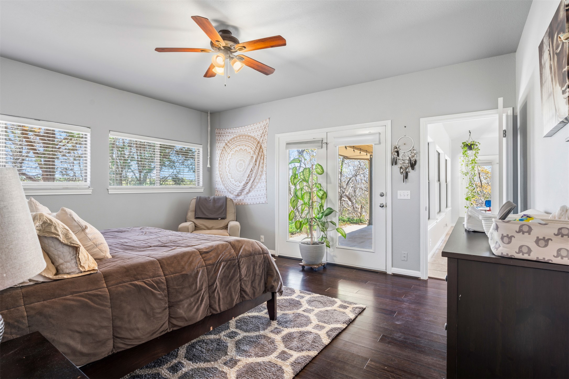 208 Amandas Way Leander, TX 78641 - Photo 9 of 25 Bedroom with access to exterior, dark wood finished floors, and a ceiling fan