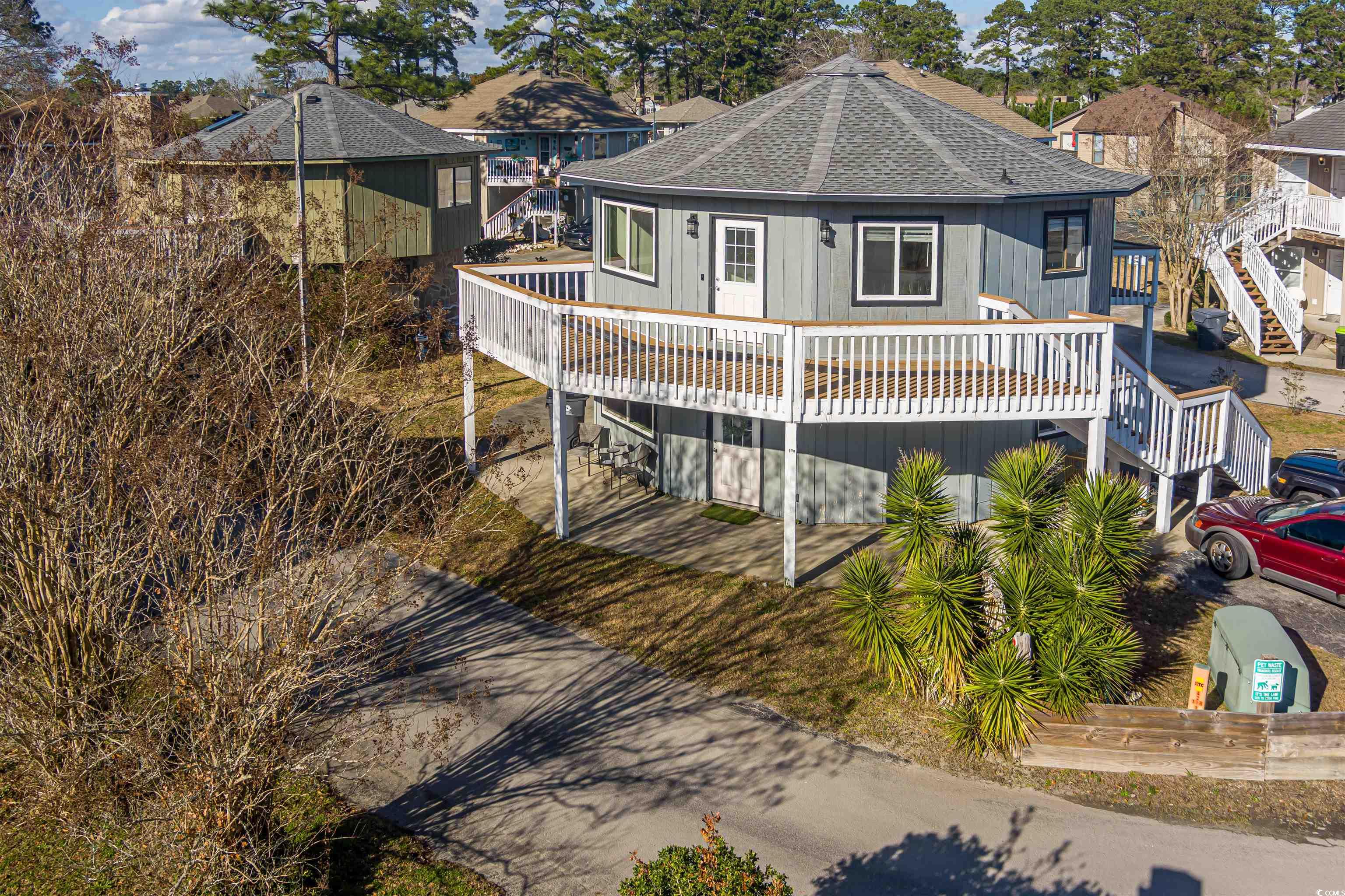 502 Tree Top Lane Myrtle Beach, SC 29588 - Photo 2 of 9 View of front facade with a shingled roof and a de