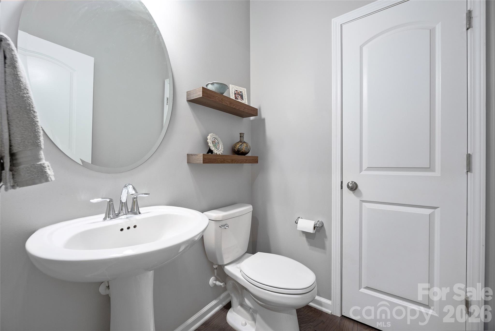 17219 Shearer Road Davidson, NC 28036 - Photo 16 of 34 a bathroom with a toilet sink and mirror