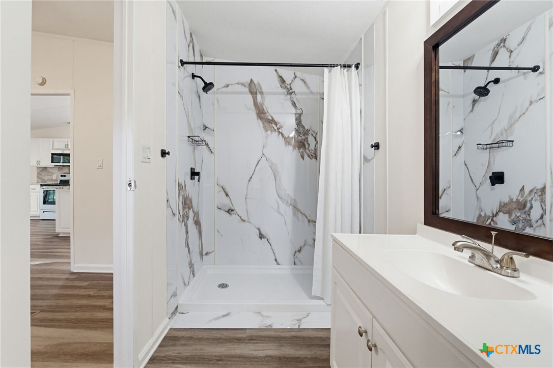 2739 Willow Loop Kempner, TX 76539 - Photo 17 of 30 a bathroom with a sink and shower
