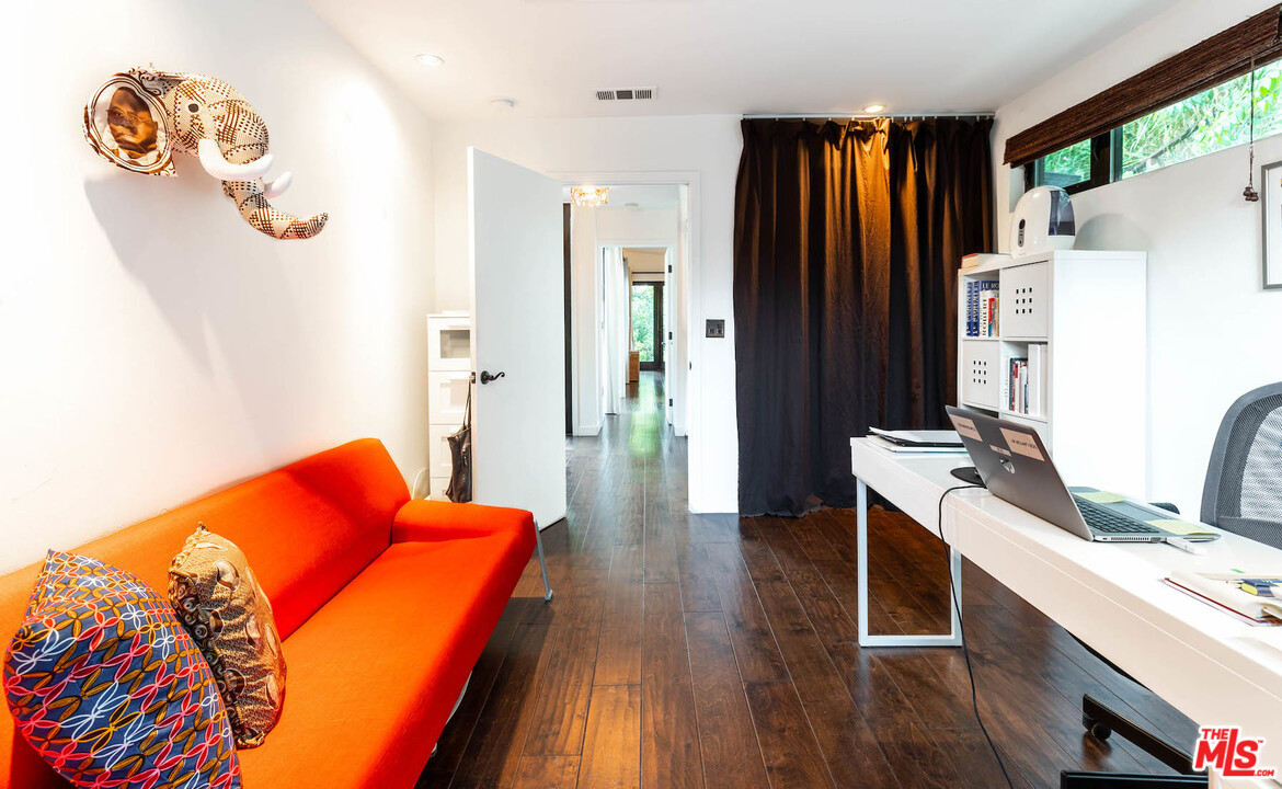 2016 Ewing Street Los Angeles, CA 90039 - Photo 16 of 33 a room with furniture and a wooden floor