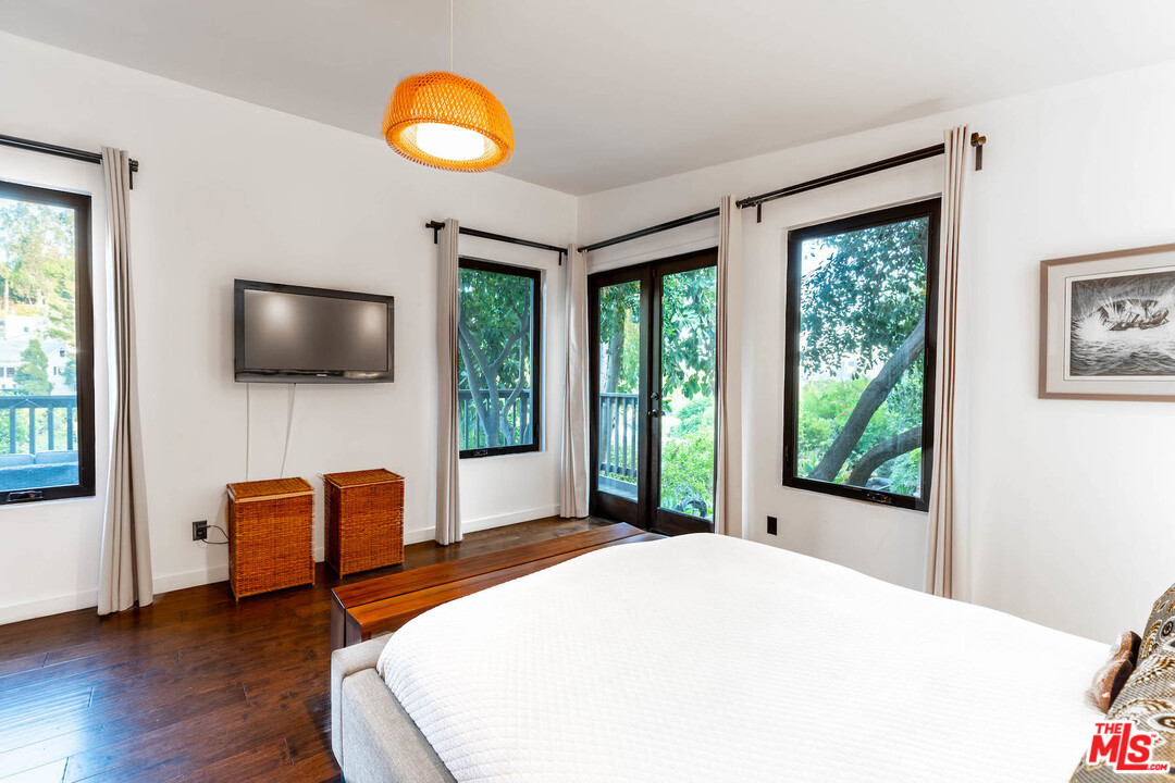 2016 Ewing Street Los Angeles, CA 90039 - Photo 18 of 33 a bedroom with furniture and a flat screen tv