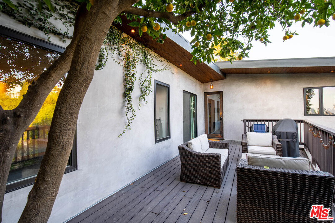 2016 Ewing Street Los Angeles, CA 90039 - Photo 20 of 33 a balcony with furniture and wooden floor