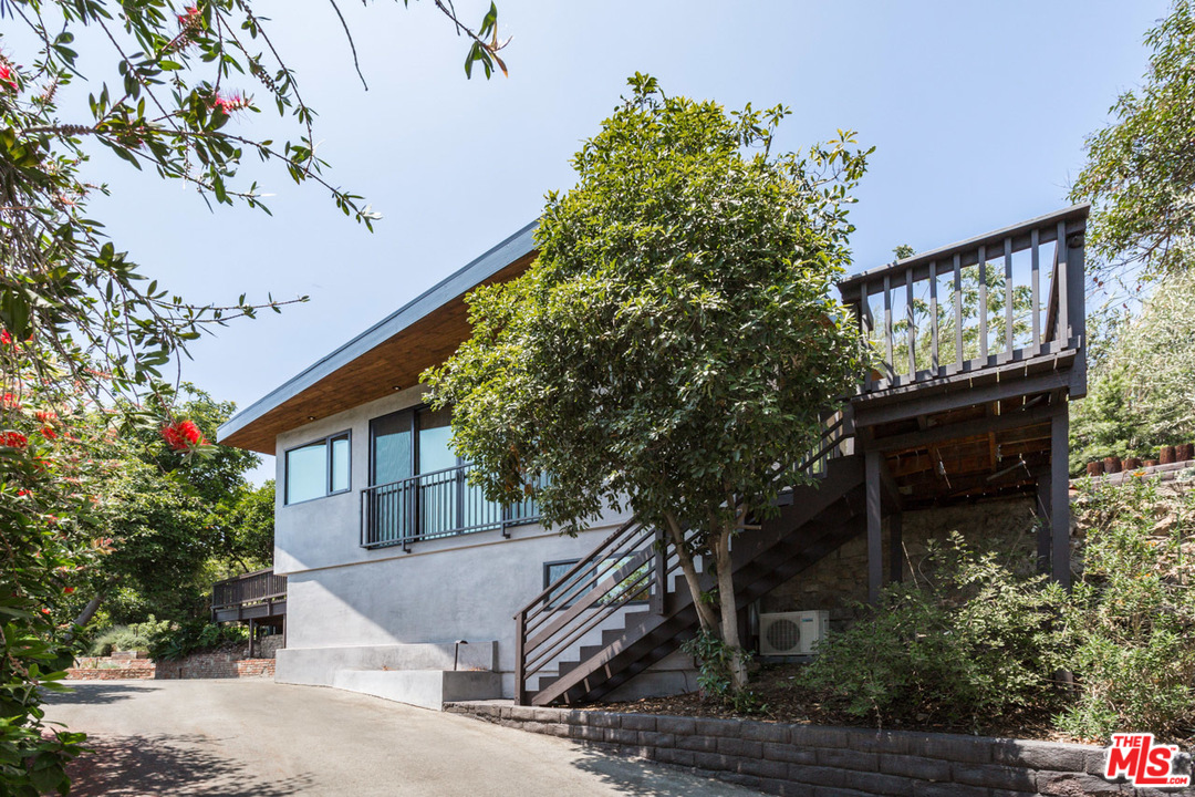 2016 Ewing Street Los Angeles, CA 90039 - Photo 3 of 33 a front view of a house with a tree