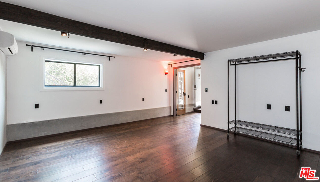 2016 Ewing Street Los Angeles, CA 90039 - Photo 28 of 33 a view of a room with wooden floor and window