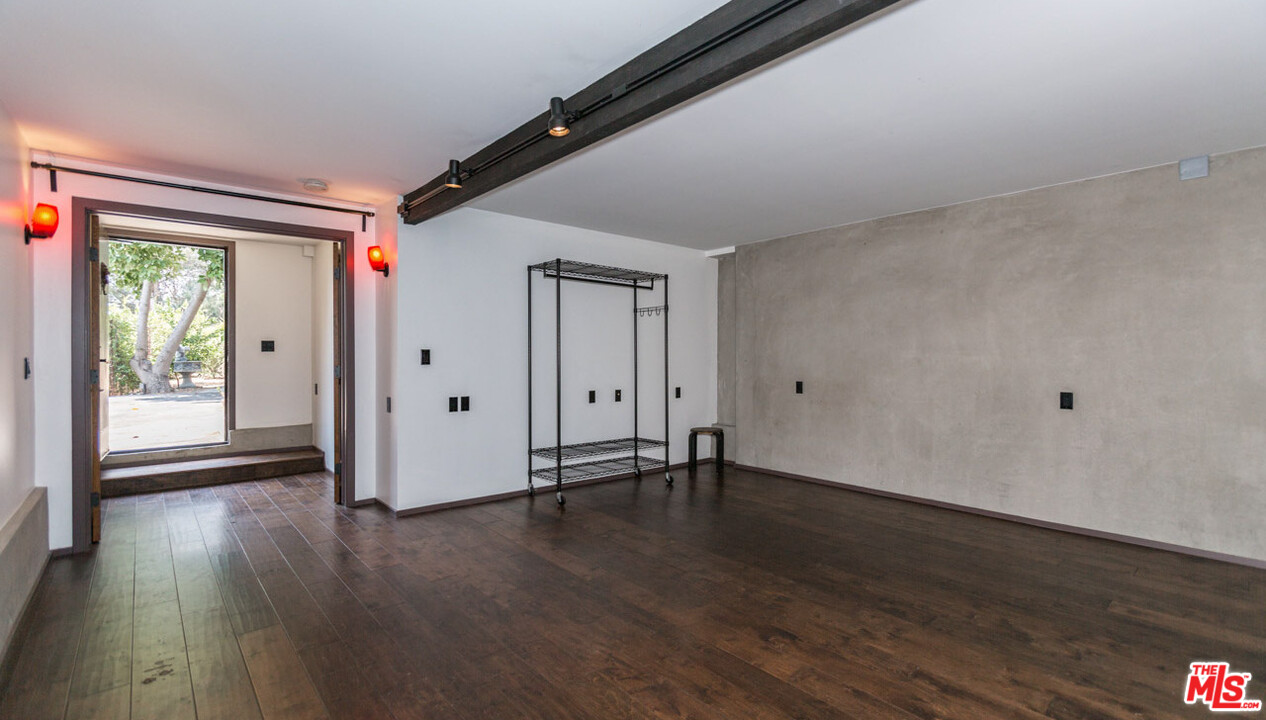 2016 Ewing Street Los Angeles, CA 90039 - Photo 29 of 33 a view of an empty room with wooden floor and a window