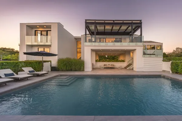 a view of a car park in front of house