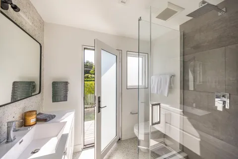 a bathroom with a tub and shower
