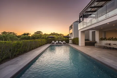 a view of a balcony with yard