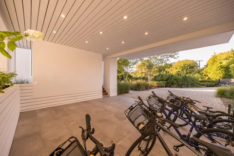 a view of a porch with furniture and backyard