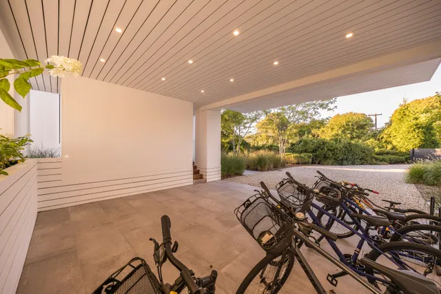 a view of a porch with furniture and backyard