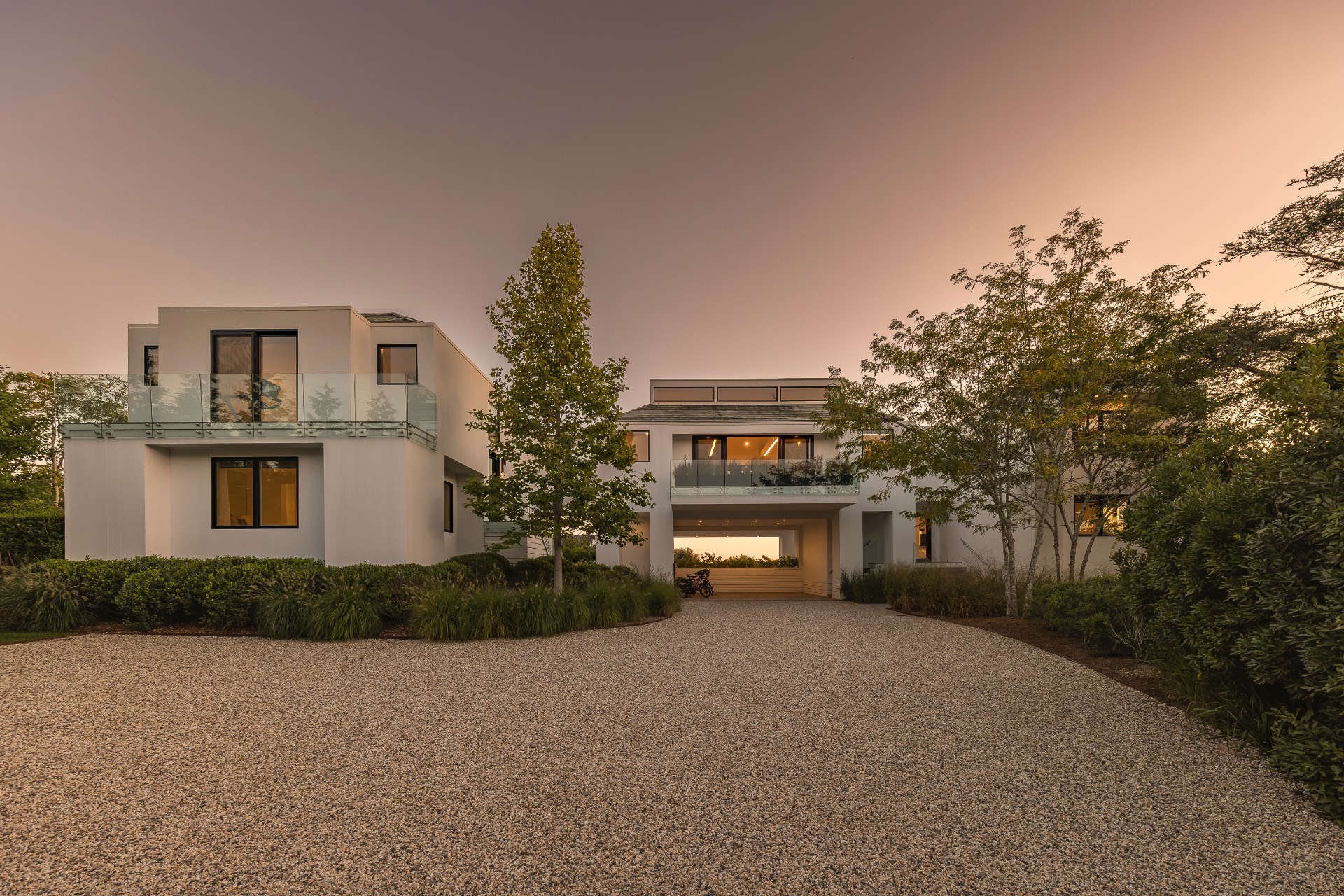 1076 Ocean Road Bridgehampton, NY 11932 - Photo 4 of 35 a front view of a house with a yard and a garage