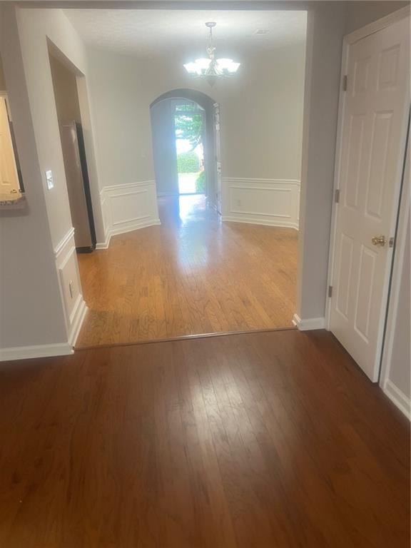 3809 Dandridge Way Northwest Duluth, GA 30096 - Photo 11 of 12 an empty room with wooden floor and windows