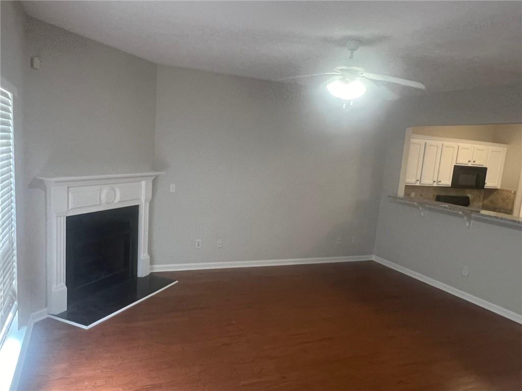 3809 Dandridge Way Northwest Duluth, GA 30096 - Photo 9 of 12 a view of empty room with window and fireplace