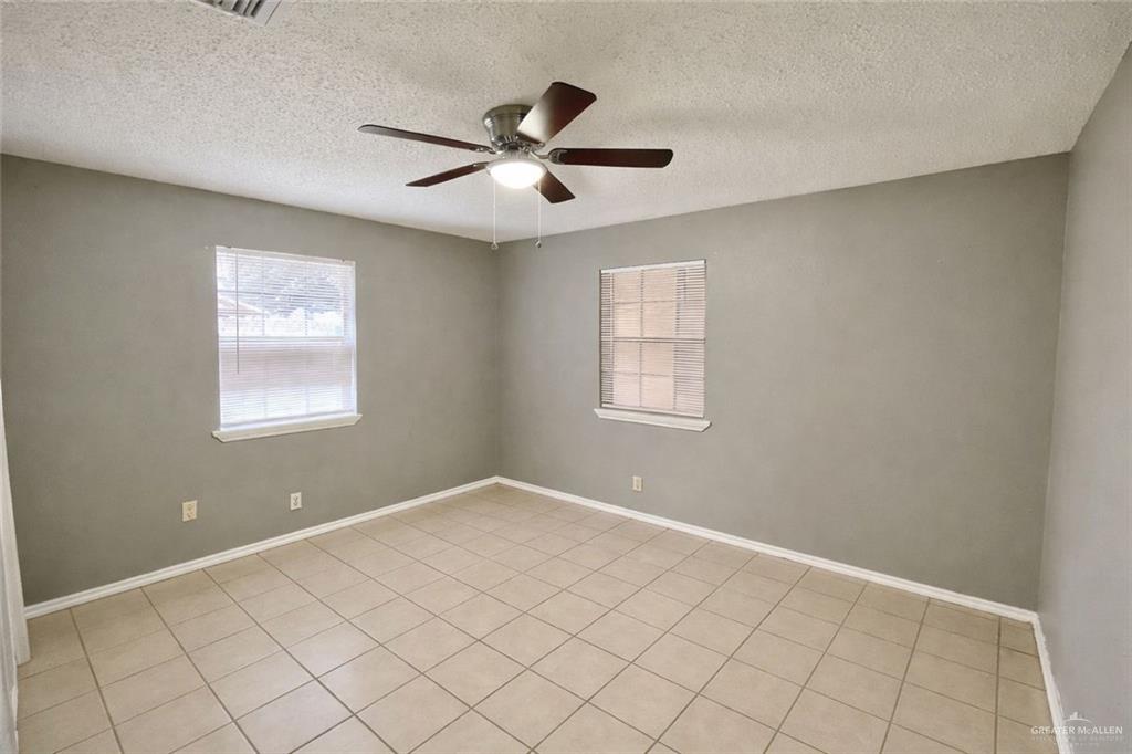 506 North McColl Road Edinburg, TX 78541 - Photo 5 of 8 a view of an empty room with window