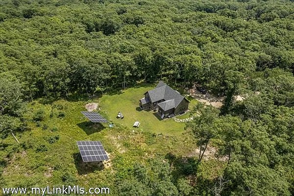 an aerial view of residential house with outdoor space