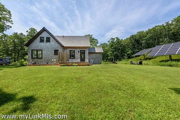 16 Red Coat Hill Road West Tisbury, MA 02568 - Photo 3 of 13 a front view of house with yard and green space