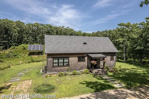 16 Red Coat Hill Road West Tisbury, MA 02568 - Photo 6 of 13 a view of a house with backyard porch and sitting area