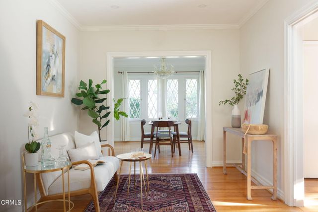a living room with furniture and a table