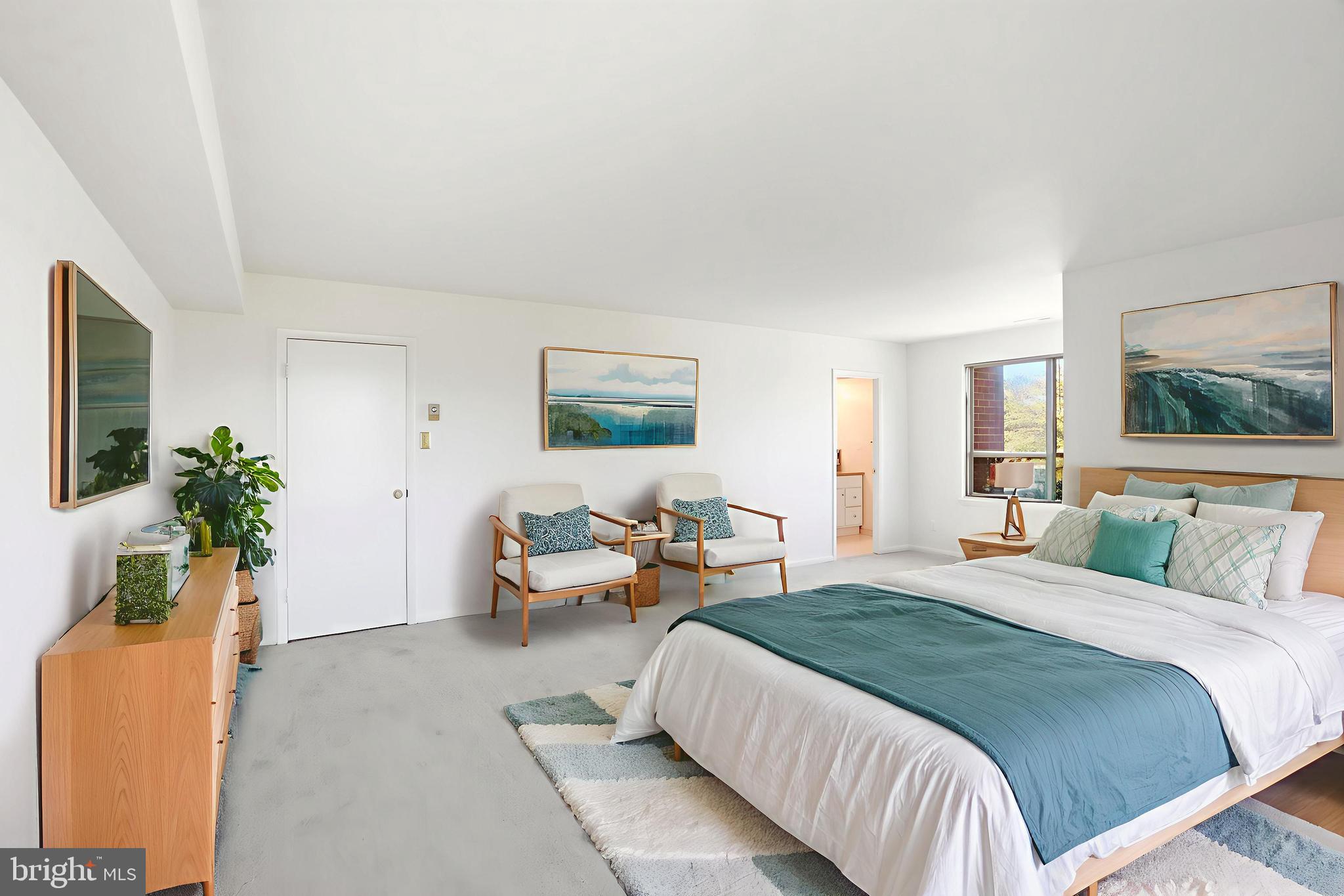 6317 Park Heights Avenue, Unit 404 Baltimore, MD 21215 - Photo 13 of 27 a bedroom with a bed and a couch