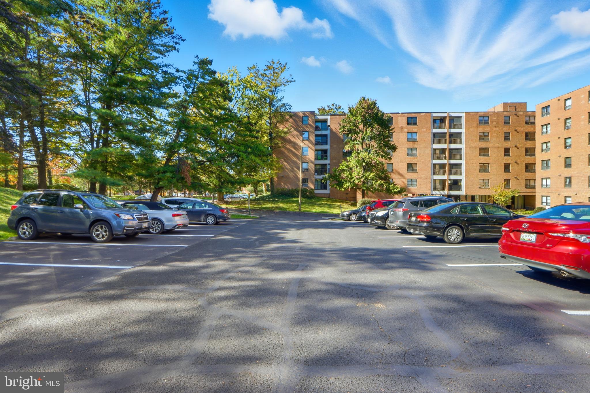 6317 Park Heights Avenue, Unit 404 Baltimore, MD 21215 - Photo 24 of 27 a cars parked on the side of a street