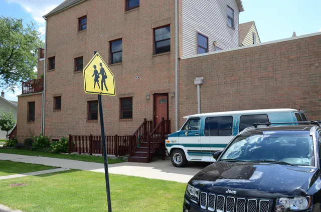 a car parked in front of a house