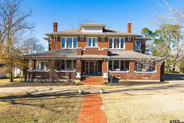 a front view of a building with street view