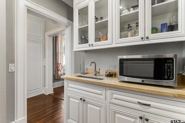 a kitchen with a sink and a microwave