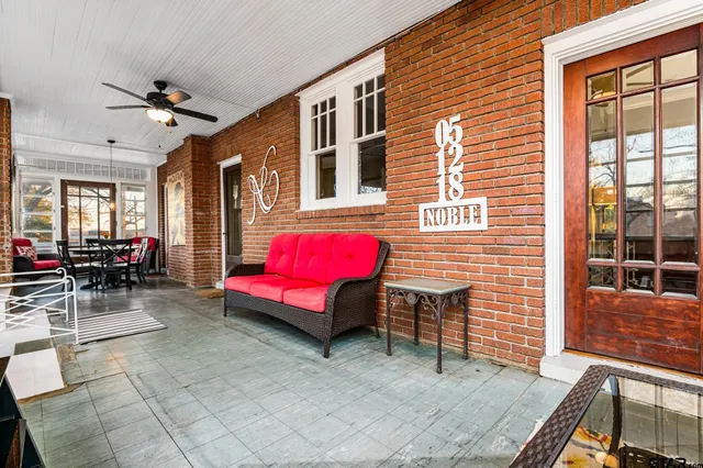 a balcony with furniture and window