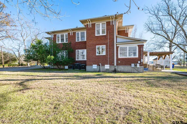 a front view of a house with a swimming pool