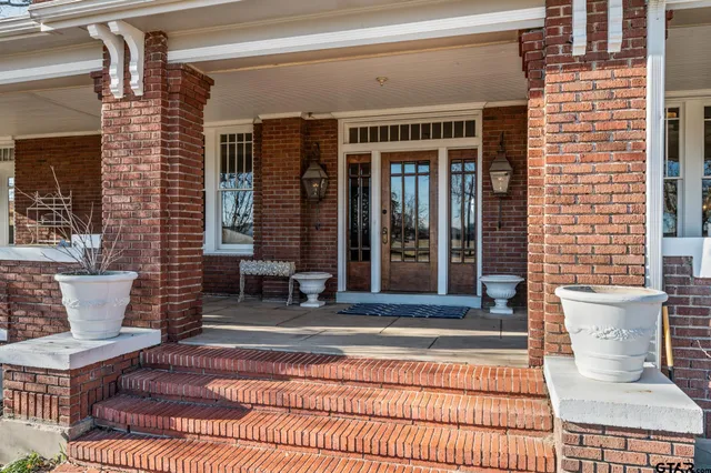 a outdoor space with a large window and couch