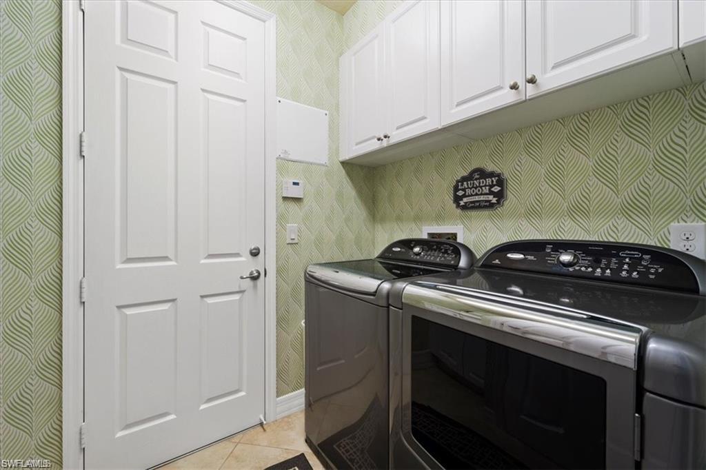 6670 Marbella Lane Naples, FL 34105 - Photo 19 of 24 a stove top oven sitting inside of a kitchen