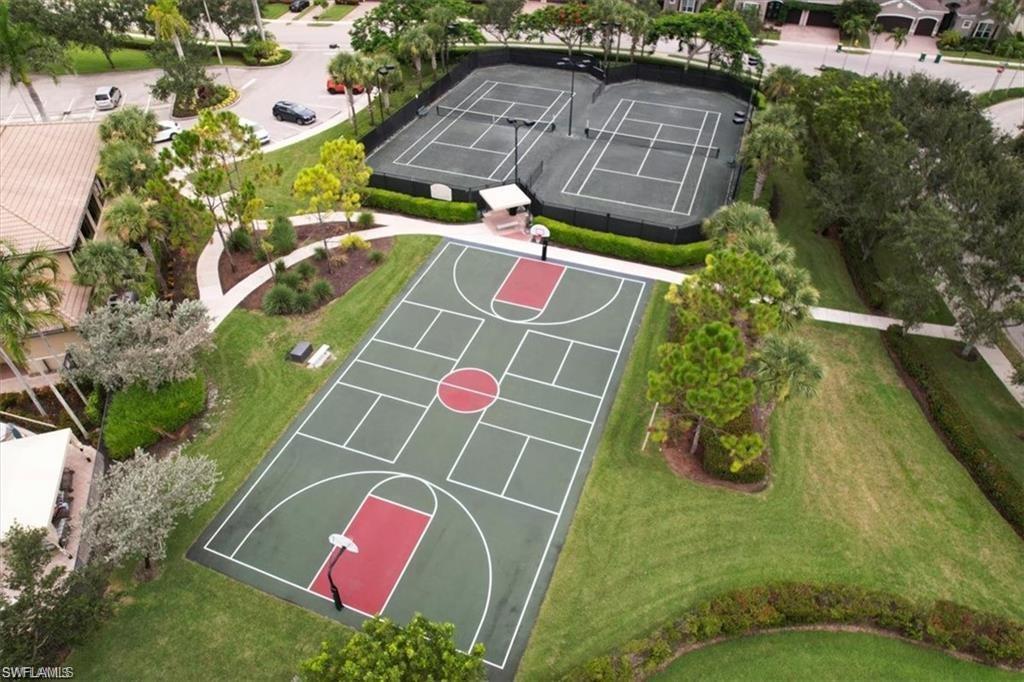 6670 Marbella Lane Naples, FL 34105 - Photo 24 of 24 an aerial view of a tennis ground with large trees