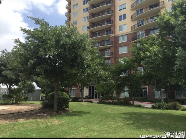 215 Center Street, Unit 1907 San Antonio, TX 78202 - Photo 1 of 21 a view of a building with a yard