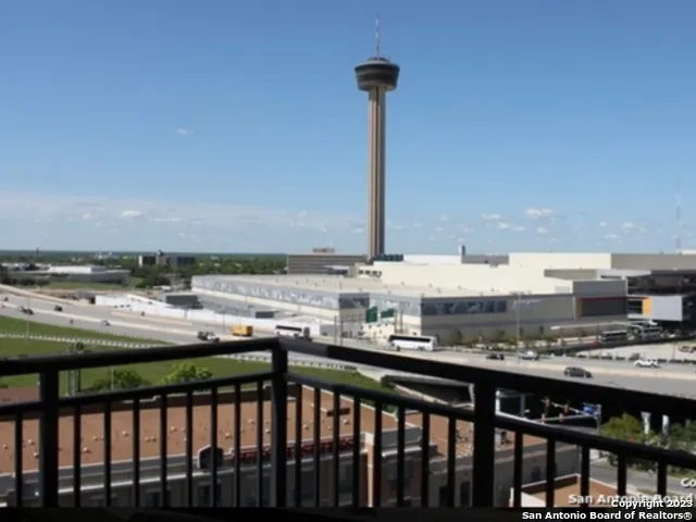 a view of a patio with a table and chairs