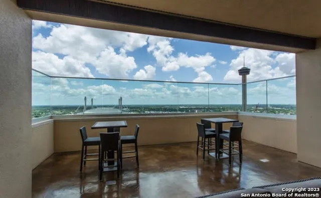 a view of a swimming pool with a patio