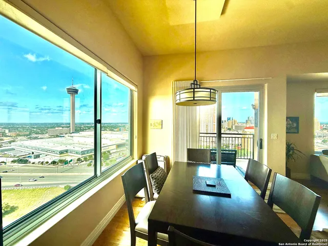a view of a dining room with furniture window and outside view