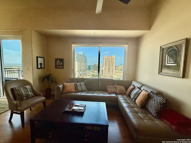 a living room with furniture and a window