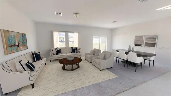 a living room with furniture potted plant and a window