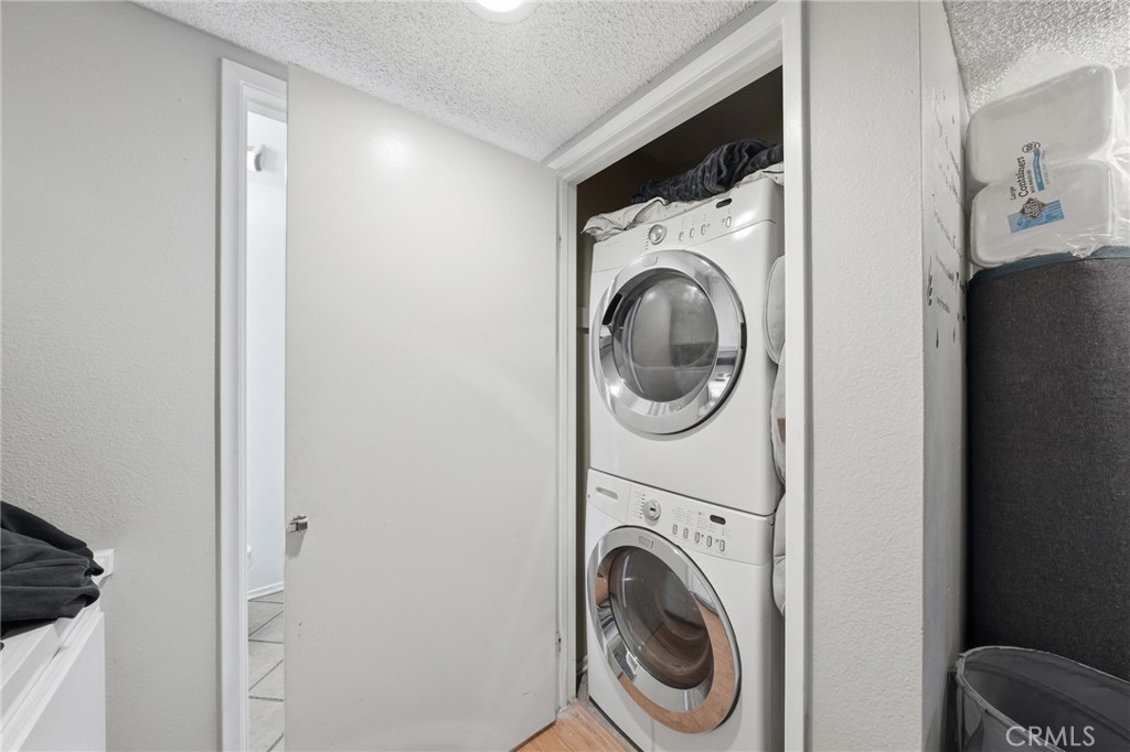 7640 Oso Avenue, Unit 318 Winnetka, CA 91306 - Photo 17 of 43 a utility room with dryer and washer