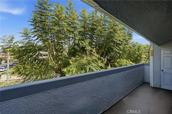 a view of a garden from a balcony