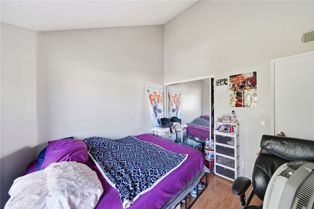 7640 Oso Avenue, Unit 318 Winnetka, CA 91306 - Photo 20 of 43 a bedroom with a bed and a closet
