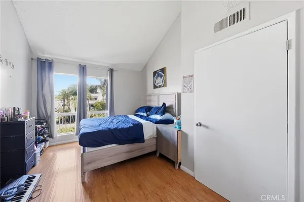 a living room with a bed furniture and a window