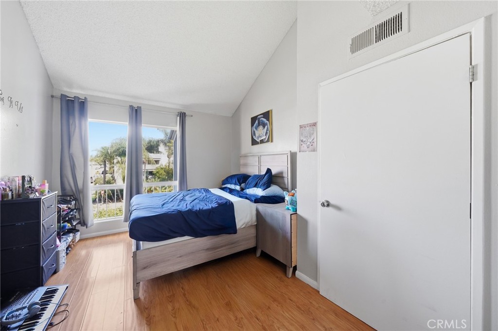 7640 Oso Avenue, Unit 318 Winnetka, CA 91306 - Photo 24 of 43 a living room with a bed furniture and a window
