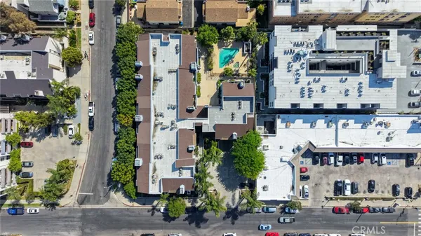 a street filled with lots of potted plants