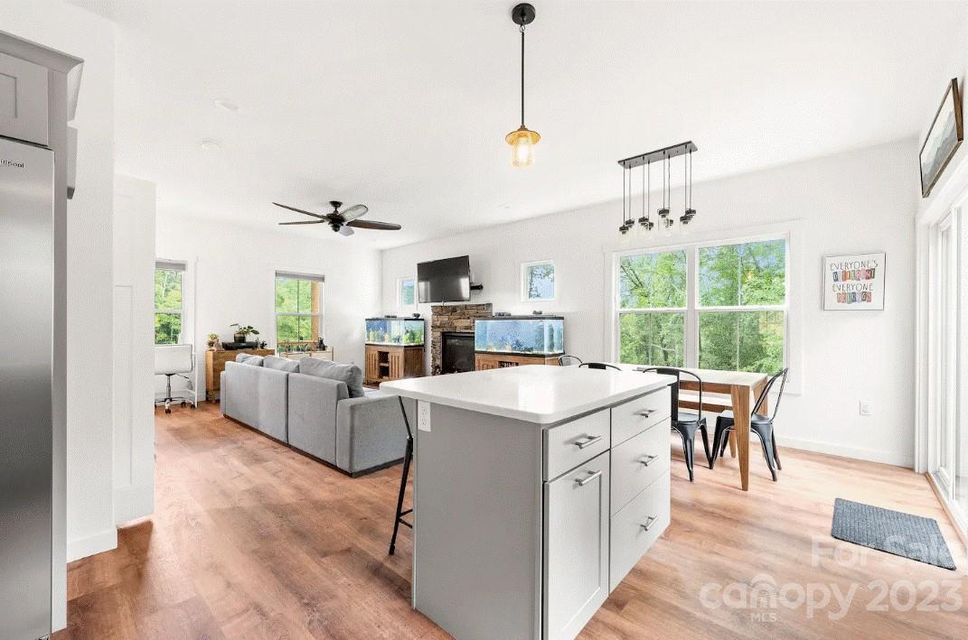 231 Medford Branch Road Candler, NC 28715 - Photo 12 of 28 a view of kitchen with furniture and wooden floor
