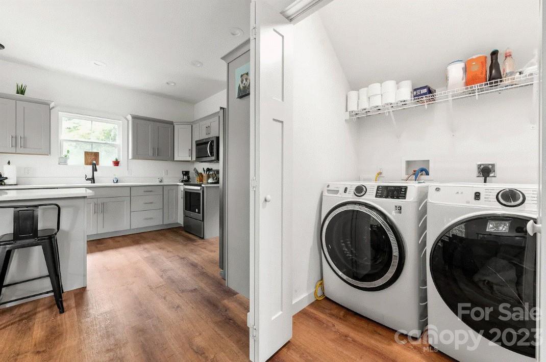 231 Medford Branch Road Candler, NC 28715 - Photo 15 of 28 a view of a kitchen with washer and dryer