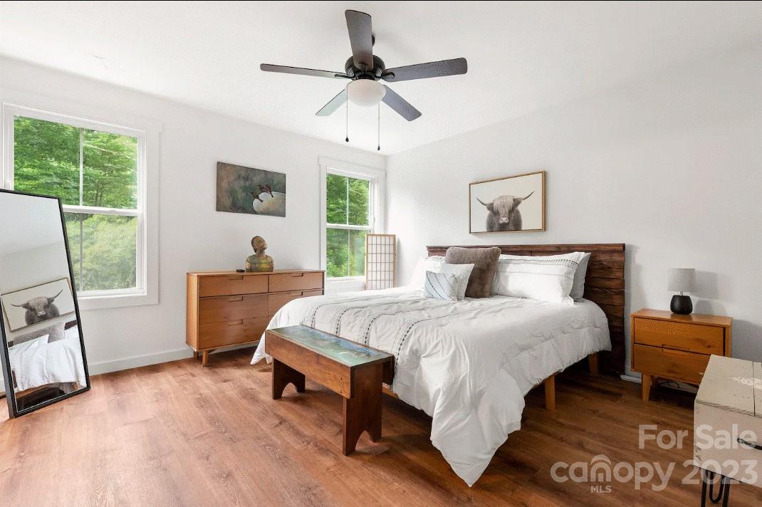 231 Medford Branch Road Candler, NC 28715 - Photo 17 of 28 a bed room with a bed and a window