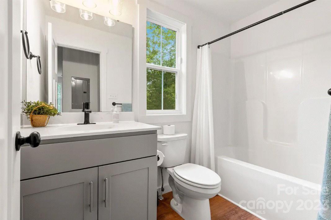 231 Medford Branch Road Candler, NC 28715 - Photo 24 of 28 a bathroom with a sink toilet and shower