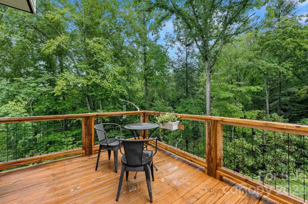 231 Medford Branch Road Candler, NC 28715 - Photo 25 of 28 a view of balcony with furniture and wooden deck